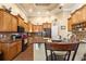 Bright eat-in kitchen featuring custom cabinets, granite countertops, and modern appliances at 5144 Riverlake Dr, Bartow, FL 33830
