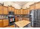 Updated kitchen with custom cabinets, granite countertops, and modern appliances at 5144 Riverlake Dr, Bartow, FL 33830