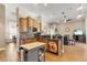 Kitchen area with tile flooring, kitchen island and open layout to living area at 5144 Riverlake Dr, Bartow, FL 33830