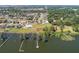 Panoramic aerial view showcasing the neighborhood's proximity to the lake, complemented by mature trees at 5144 Riverlake Dr, Bartow, FL 33830