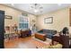 Living room with hardwood floors, ample natural light, and built-in bookshelves at 5144 Riverlake Dr, Bartow, FL 33830