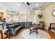 Spacious living room with leather furniture and open floor plan at 5144 Riverlake Dr, Bartow, FL 33830
