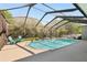 Relaxing screened-in pool with clear blue water and a serene, private backyard at 5144 Riverlake Dr, Bartow, FL 33830