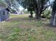 Expansive backyard featuring mature trees providing shade and character to the property at 5580 Hwy 542 W, Winter Haven, FL 33880