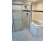 Bathroom featuring a glass-enclosed shower and a tiled jacuzzi tub, providing a spa-like feel at 5580 Hwy 542 W, Winter Haven, FL 33880