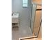Bathroom featuring a shower, single vanity, and black and white patterned tile flooring at 5580 Hwy 542 W, Winter Haven, FL 33880