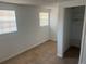 Bedroom featuring tile flooring, bright windows, and closet at 5580 Hwy 542 W, Winter Haven, FL 33880