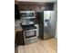 Kitchen featuring stainless steel appliances and dark cabinetry at 5580 Hwy 542 W, Winter Haven, FL 33880