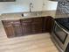 Modern kitchen with granite countertops, stainless steel appliances, and updated dark cabinets at 5580 Hwy 542 W, Winter Haven, FL 33880