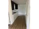 Kitchen featuring granite countertops and wood-look flooring, creating a modern, inviting space at 5580 Hwy 542 W, Winter Haven, FL 33880