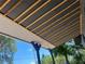 This patio features newly installed black painted beams and white ceiling paneling at 5580 Hwy 542 W, Winter Haven, FL 33880