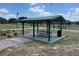 Shaded picnic area with tables provides a relaxing space for outdoor dining and community gatherings at 5580 Hwy 542 W, Winter Haven, FL 33880