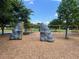Community playground with climbing structures, swings, and a cushioned ground cover for safety at 5580 Hwy 542 W, Winter Haven, FL 33880