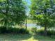 Picturesque pond view with lush greenery, creating a serene natural backdrop at 5580 Hwy 542 W, Winter Haven, FL 33880