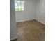 An Empty room with light beige walls and ceramic tile floor at 5580 Hwy 542 W, Winter Haven, FL 33880