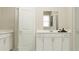 Clean bathroom featuring a double vanity, white cabinets, and modern fixtures at 698 Peroni Ave, Debary, FL 32713