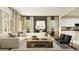 Comfortable living room with lots of natural light and modern furnishings at 698 Peroni Ave, Debary, FL 32713