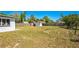 Fenced backyard featuring a green lawn and two storage sheds at the rear at 1475 3Rd Ave, Deland, FL 32724