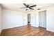 Bright bedroom featuring laminate flooring, ceiling fan and white trim at 1475 3Rd Ave, Deland, FL 32724