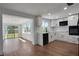 Modern kitchen features stainless steel appliances, white cabinetry, and an open layout at 1475 3Rd Ave, Deland, FL 32724