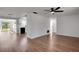 Open-concept living area with modern flooring connecting to the kitchen at 1475 3Rd Ave, Deland, FL 32724