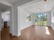 Bright living room with wood floors and large windows offering plenty of natural light at 1475 3Rd Ave, Deland, FL 32724