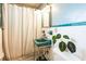 Bathroom showcasing vintage teal sink, tiled walls, and a shower with curtain at 2908 Maplewood Ave, Lakeland, FL 33803