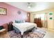 Comfortable bedroom with a plush rug, soft bedding, and calming decor at 2908 Maplewood Ave, Lakeland, FL 33803