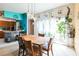 Open dining room flows to kitchen area with modern hanging light fixture at 2908 Maplewood Ave, Lakeland, FL 33803