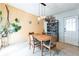 Bright dining room with a wood table, seating for four, and a vintage display cabinet at 2908 Maplewood Ave, Lakeland, FL 33803
