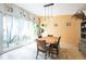 Dining room with natural light, unique light fixture, and table with seating for four at 2908 Maplewood Ave, Lakeland, FL 33803