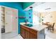 Cozy kitchen featuring a cooktop, ample counter space, and unique colorful accents at 2908 Maplewood Ave, Lakeland, FL 33803