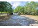 Large backyard featuring a shed and mature trees at 3365 Bahama Ct, Lake Wales, FL 33898