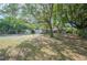 Large backyard with a shed, mature trees and grass at 3365 Bahama Ct, Lake Wales, FL 33898