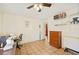 Bright and open room with tile flooring, fan, and door to another room at 3365 Bahama Ct, Lake Wales, FL 33898