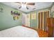 Inviting bedroom with a ceiling fan, decorative artwork, and ample natural light at 3365 Bahama Ct, Lake Wales, FL 33898
