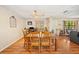 Dining room area featuring wood floors, a ceiling fan, and space for a large dining table at 3365 Bahama Ct, Lake Wales, FL 33898
