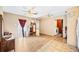 A light-filled living space with mixed flooring, modern light fixture, and access to laundry at 3365 Bahama Ct, Lake Wales, FL 33898