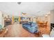 Spacious open-concept living area with fireplace, tile flooring, dining space, and access to outdoor patio at 3365 Bahama Ct, Lake Wales, FL 33898