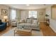Inviting living room with neutral tones, complemented by ample natural light and stylish furnishings at 3533 Roanoke St, The Villages, FL 32162