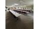 Spacious hall with numerous tables and chairs set up for a gathering or event at 65 Joppa Dr, Winter Haven, FL 33884