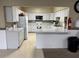 Well-equipped kitchen with ample counter space, white cabinetry and modern appliances at 65 Joppa Dr, Winter Haven, FL 33884