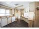The kitchen features a double sink and white cabinetry at 65 Joppa Dr, Winter Haven, FL 33884