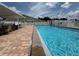 Enjoy the lovely community swimming pool, with chairs and tables for relaxing poolside at 65 Joppa Dr, Winter Haven, FL 33884