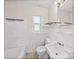 Bathroom featuring white tiles, a standard toilet, and a classic sink basin at 3928 Cherry Way, Lakeland, FL 33805