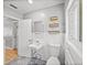 Brightly lit bathroom with standard toilet and sink basin at 3928 Cherry Way, Lakeland, FL 33805