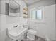 Bathroom featuring a window for natural light and a standard toilet at 3928 Cherry Way, Lakeland, FL 33805