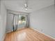 Bedroom with hardwood floors and a window with natural light at 3928 Cherry Way, Lakeland, FL 33805