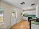 Practical kitchen with white cabinets, black appliances, and a door leading to the backyard at 3928 Cherry Way, Lakeland, FL 33805