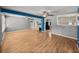 Spacious living room featuring hard wood floors and blue accent columns at 3928 Cherry Way, Lakeland, FL 33805